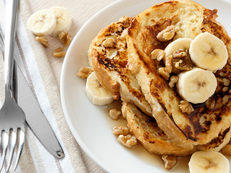 French toast topped with banana and walnuts